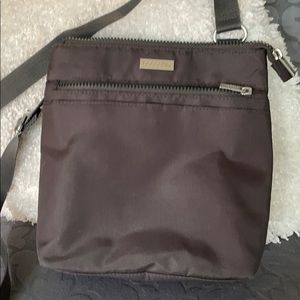 Baggallini NWOT dark gray in color with purple inside
